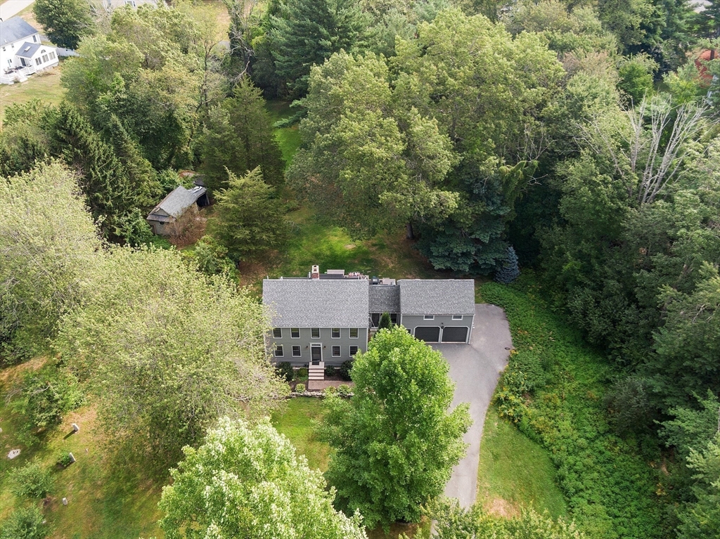 195 Haggetts Pond Road Andover, MA 01810 - Photo 2 of 3 an aerial view of a house with yard and outdoor seating