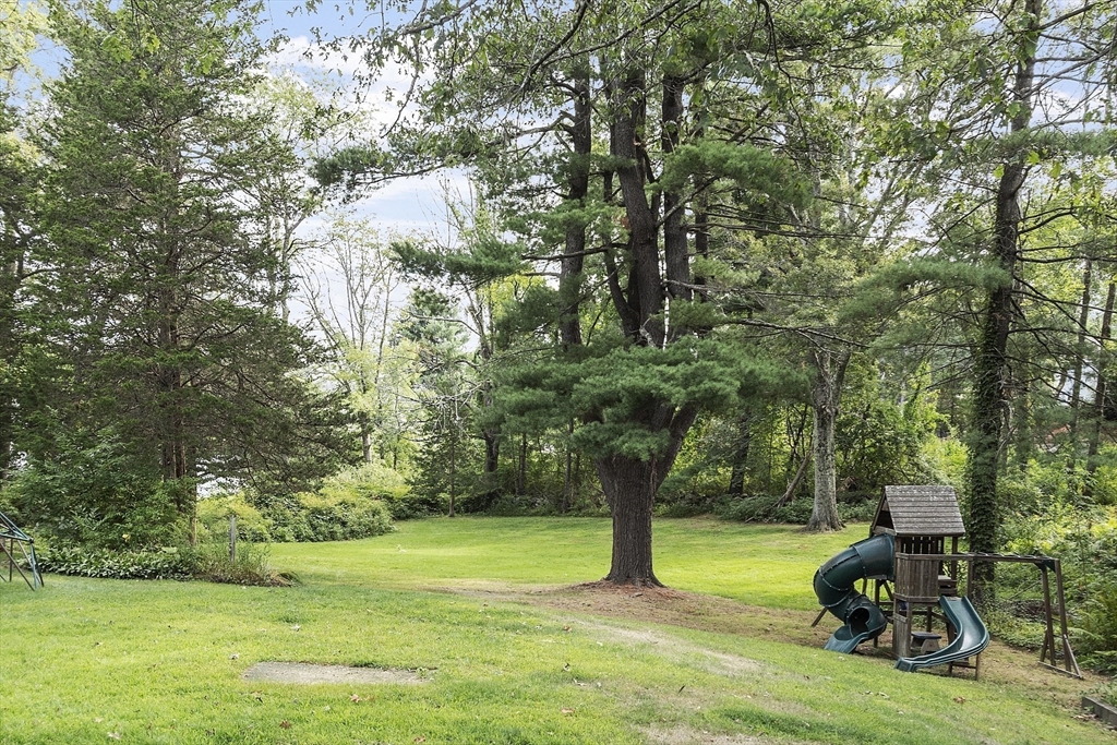 195 Haggetts Pond Road Andover, MA 01810 - Photo 3 of 3 a view of a yard with a tree