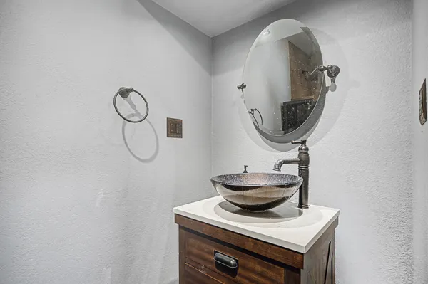 a bathroom with a sink and a mirror