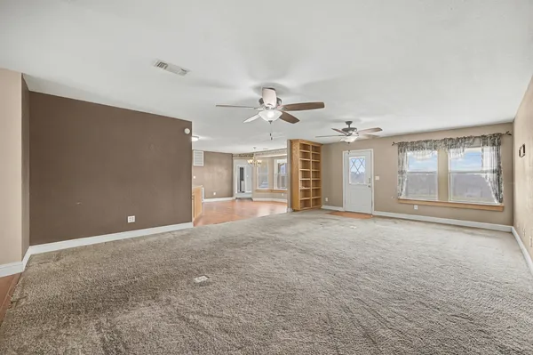a view of an empty room with a window