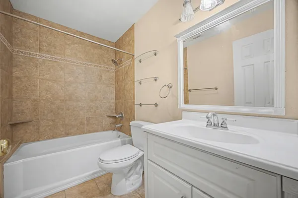 a bathroom with a sink a toilet and a bathtub