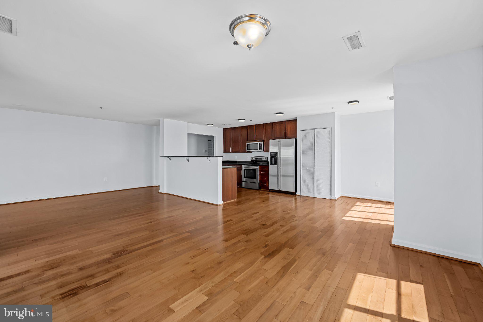2702 Lighthouse Point East, Unit 738 Baltimore, MD 21224 - Photo 12 of 33 Spacious modern living area awaits you.