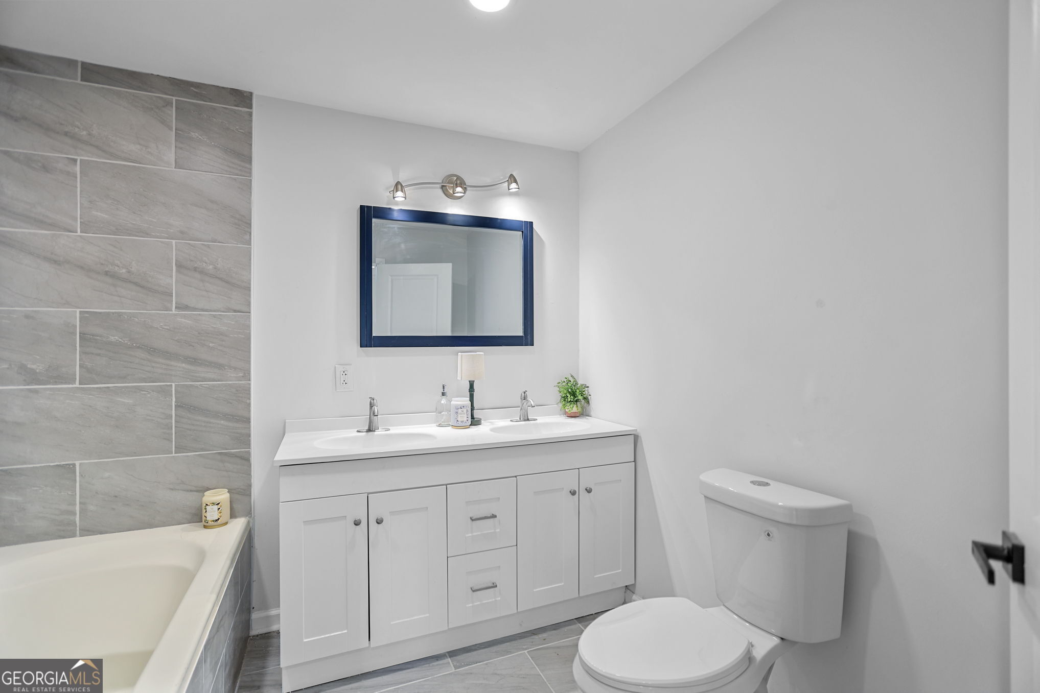 7060 Scenic Heights Road Manchester, GA 31816 - Photo 39 of 52 a bathroom with a toilet sink double vanity and mirror