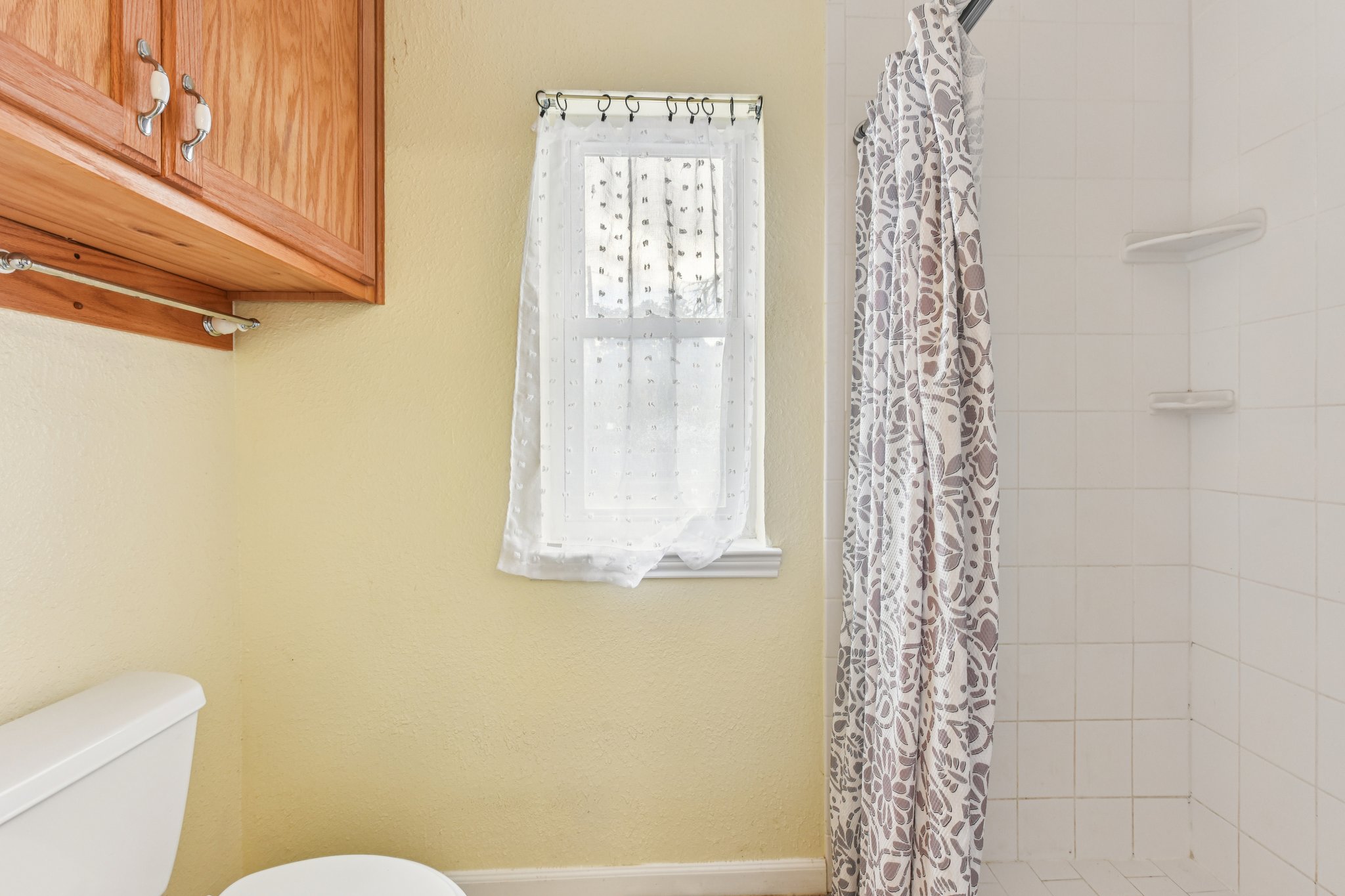 504 Buckaroo Trail Buda, TX 78610 - Photo 13 of 39 Full bathroom with a stall shower and toilet