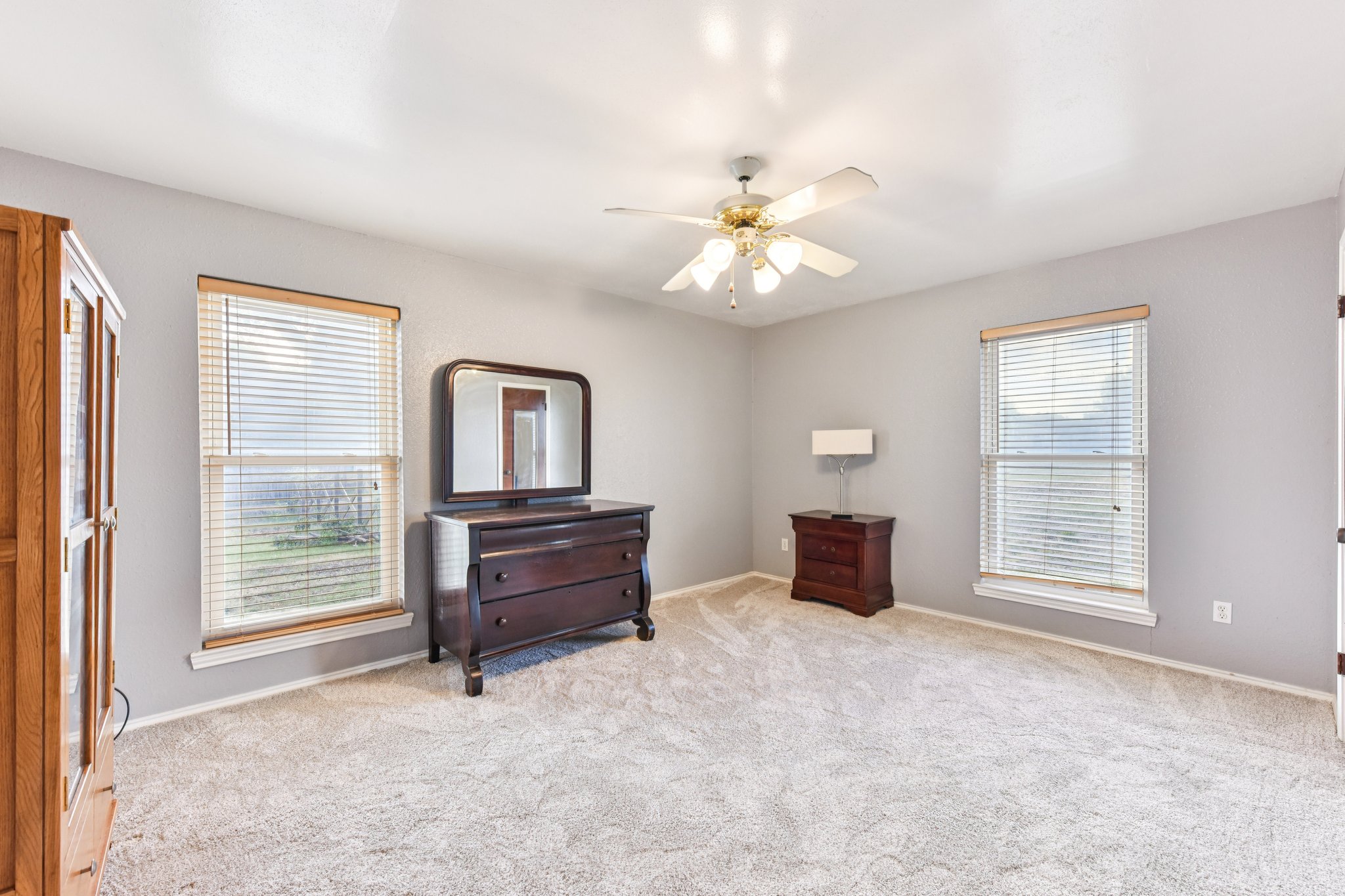 504 Buckaroo Trail Buda, TX 78610 - Photo 16 of 39 Bedroom with carpet flooring and ceiling fan