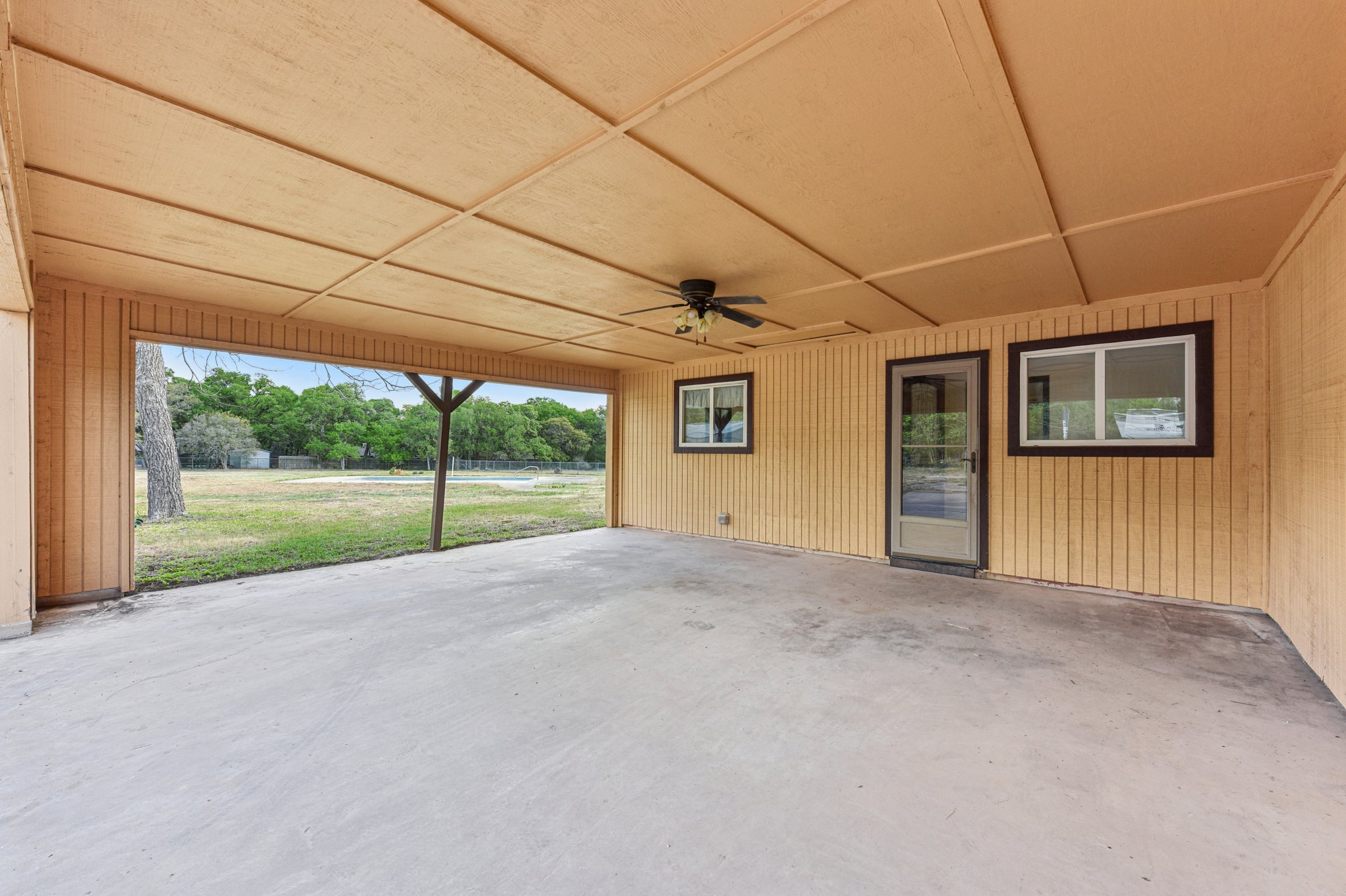 504 Buckaroo Trail Buda, TX 78610 - Photo 23 of 39 View of patio with ceiling fan that opens to backyard pool area