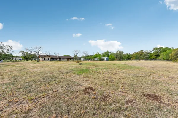 a view of a lake with houses in the background
