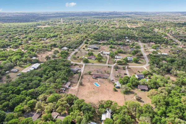 an aerial view of residential building and green space
