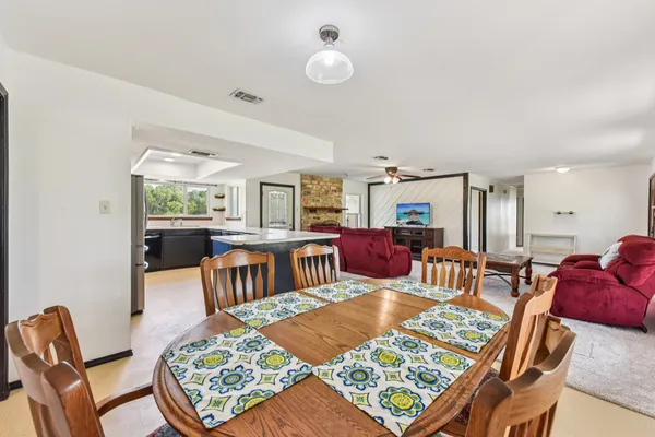 a kitchen with stainless steel appliances a refrigerator sink and cabinets