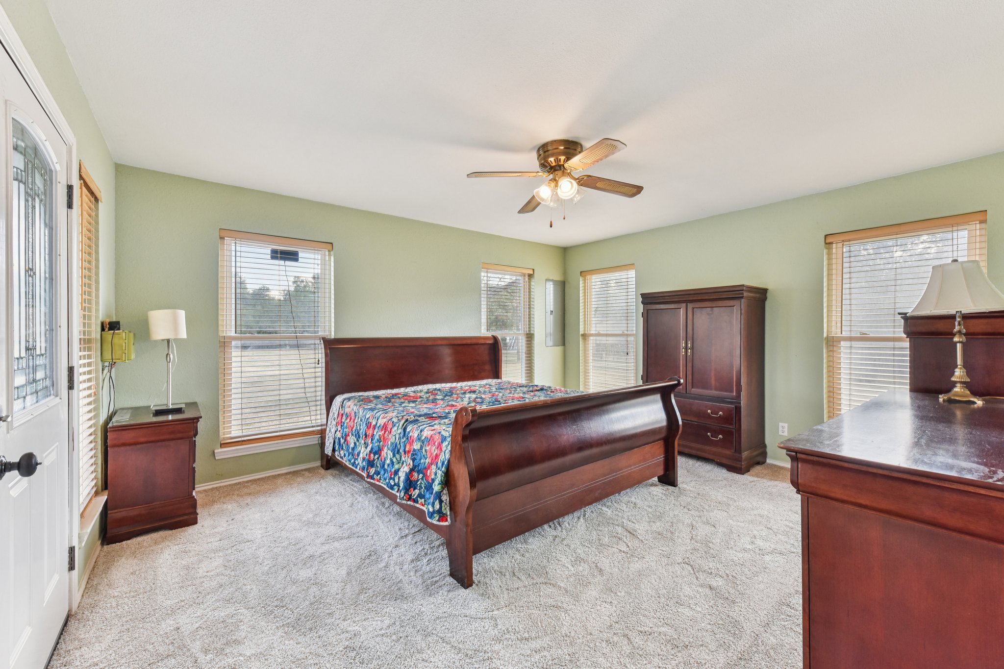 504 Buckaroo Trail Buda, TX 78610 - Photo 9 of 39 Bedroom with a ceiling fan and light colored carpet