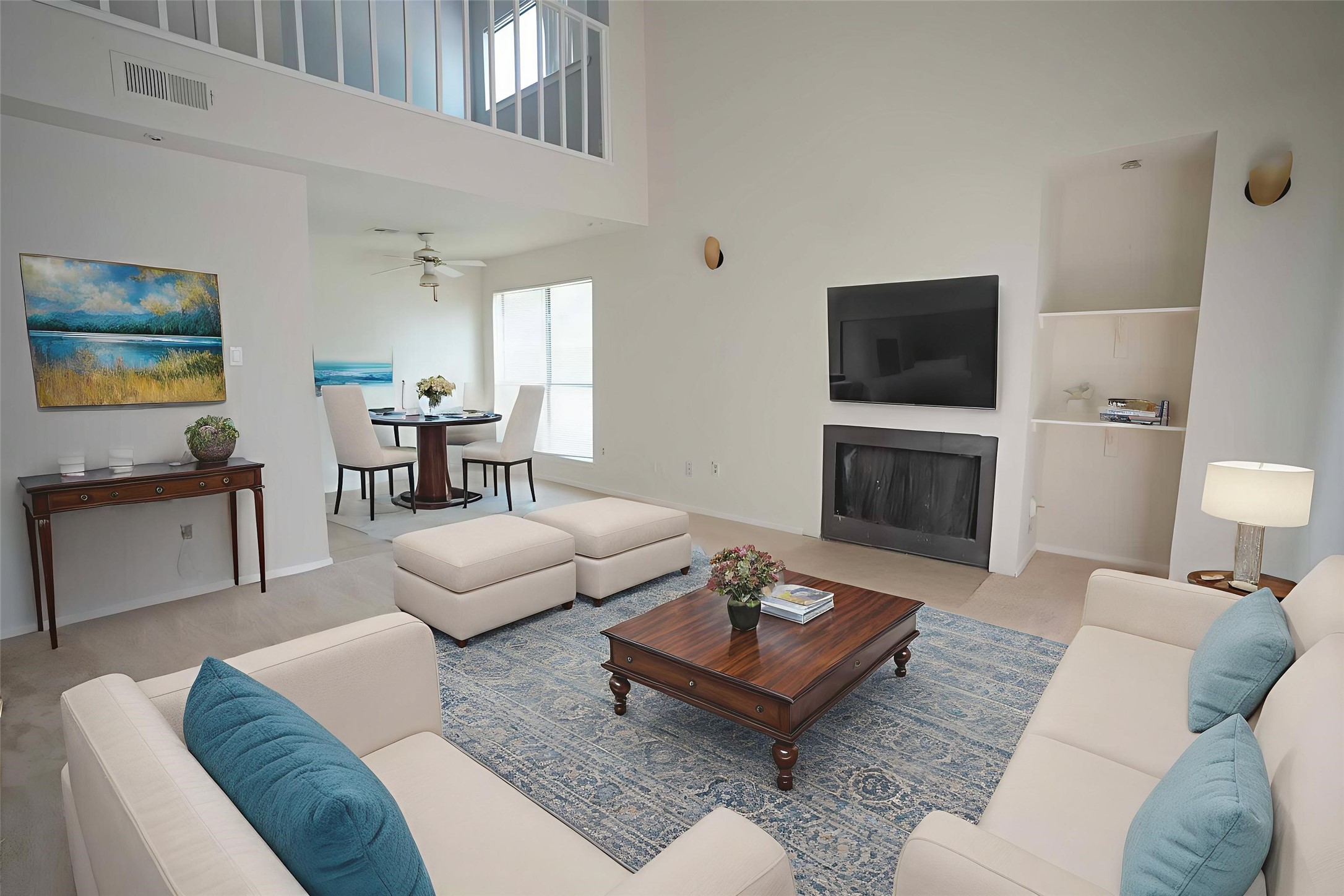 a living room with furniture a rug and a fireplace