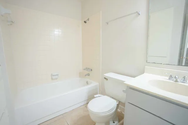 a bathroom with a sink a toilet and a bathtub