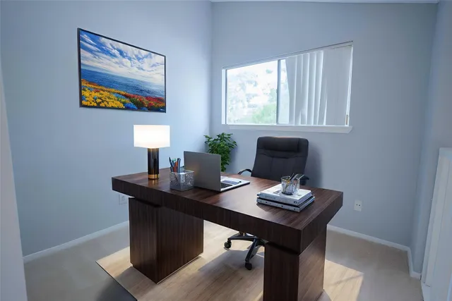 a view of a workspace with furniture