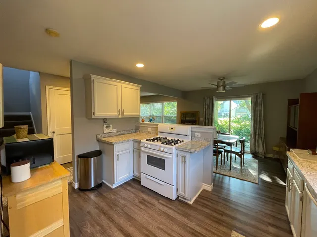 a kitchen with a stove and a microwave