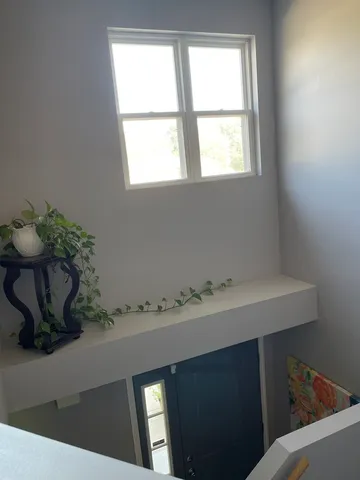 a bathroom with a sink and a window