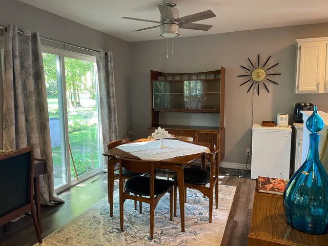 a dinning table and chairs in a room