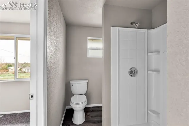 a bathroom with a sink a mirror and a window