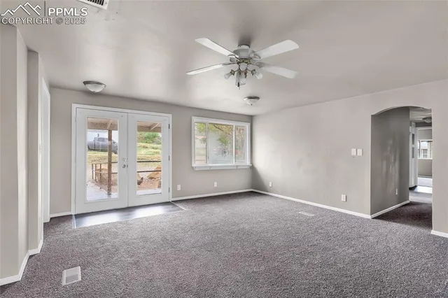 a view of an empty room with a window