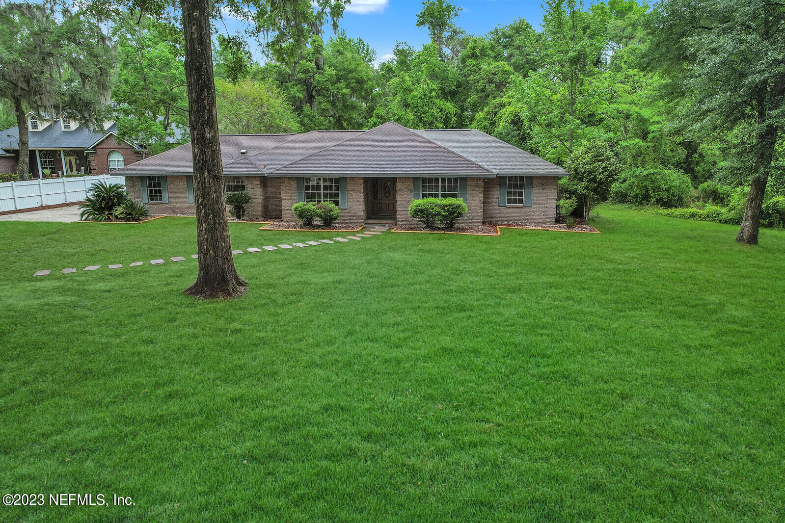 4250 Banks Road Middleburg, FL 32068 - Photo 1 of 48 a front view of a house with garden
