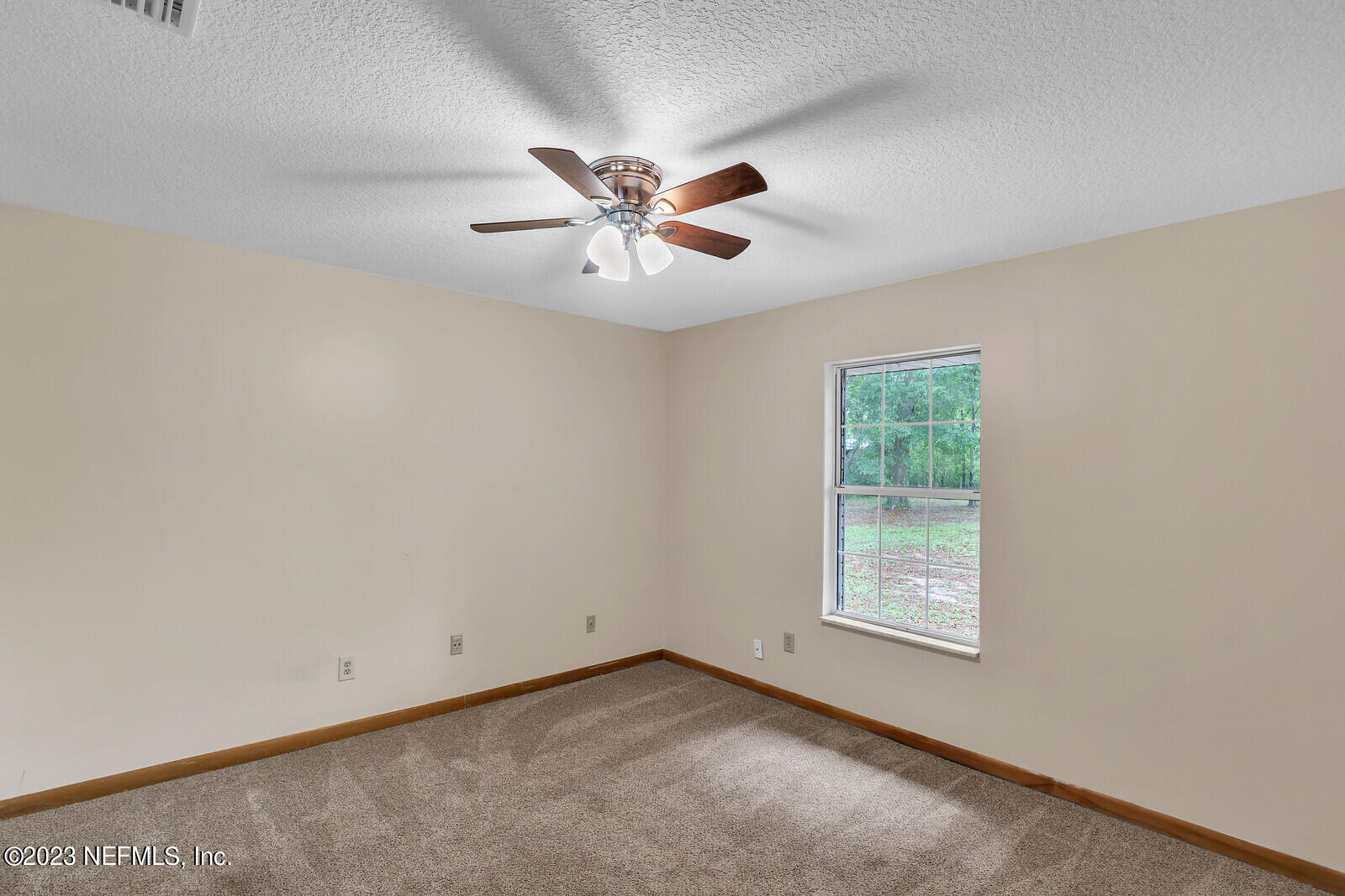 4250 Banks Road Middleburg, FL 32068 - Photo 14 of 48 an empty room with windows and fan