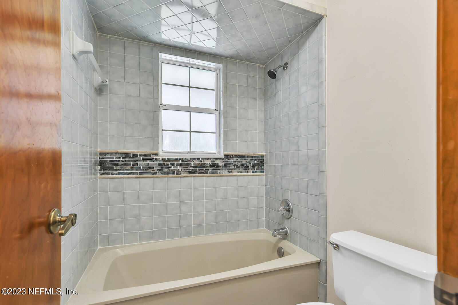 4250 Banks Road Middleburg, FL 32068 - Photo 17 of 48 a bathroom with a bathtub and a shower