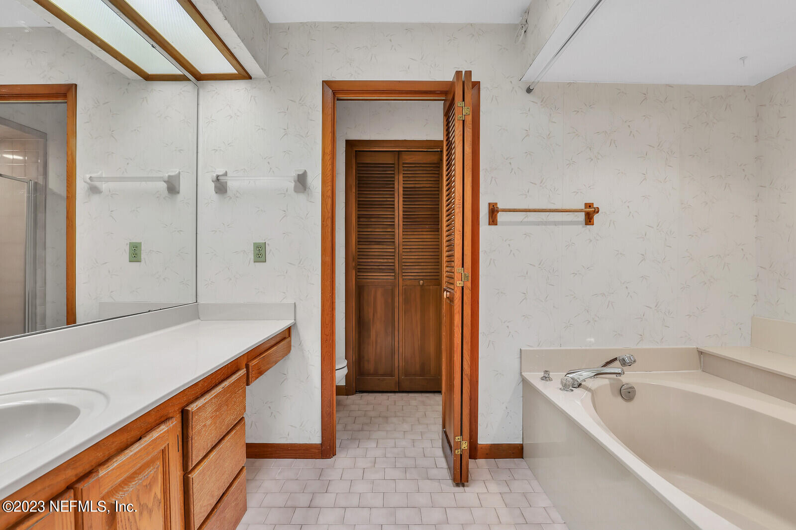 4250 Banks Road Middleburg, FL 32068 - Photo 19 of 48 a bathroom with a tub sink and shower
