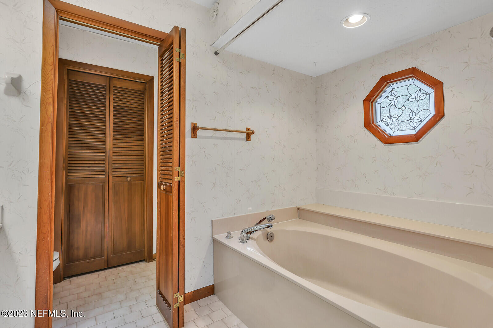 4250 Banks Road Middleburg, FL 32068 - Photo 21 of 48 a bathroom with a bathtub and shower