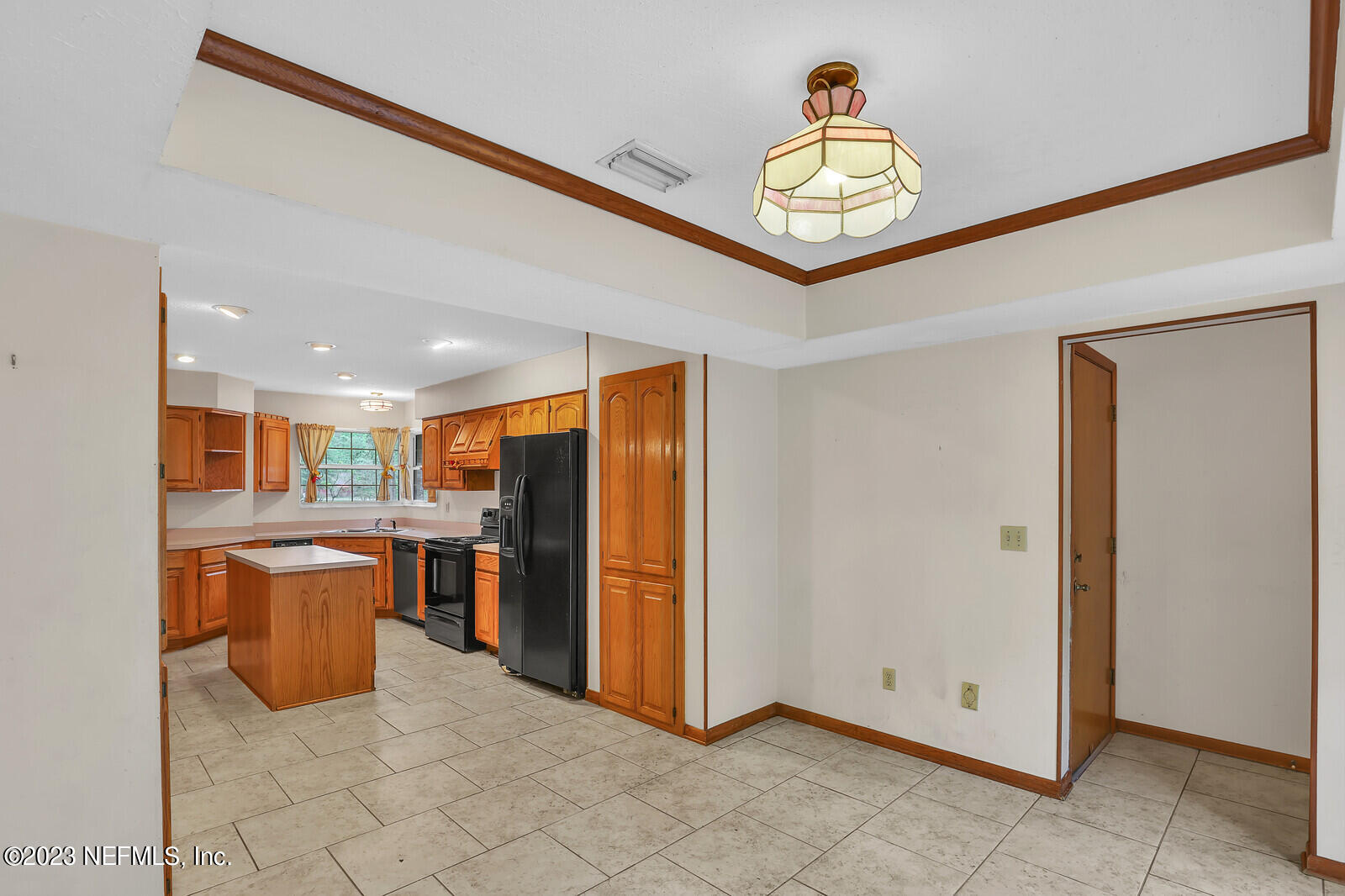 4250 Banks Road Middleburg, FL 32068 - Photo 25 of 48 a very nice looking open kitchen with stainless steel appliances granite countertop a refrigerator and a sink