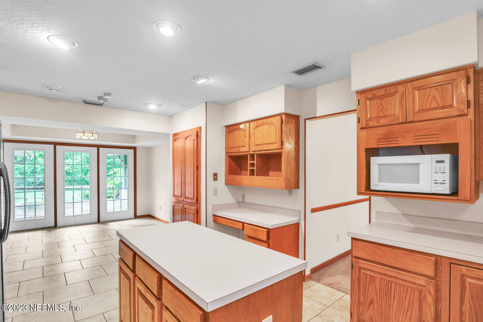 4250 Banks Road Middleburg, FL 32068 - Photo 30 of 48 a bedroom with a bed and large windows