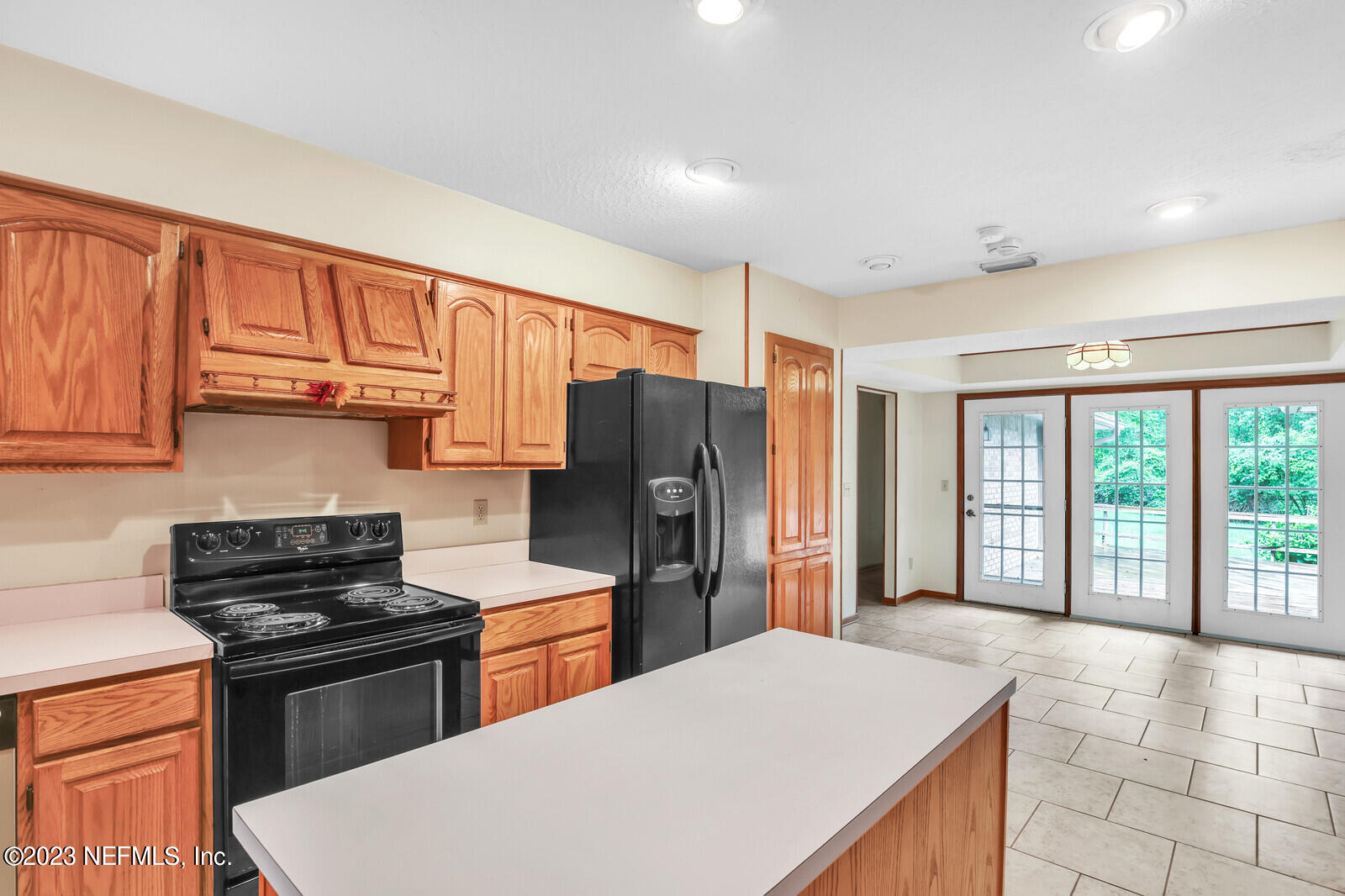 4250 Banks Road Middleburg, FL 32068 - Photo 31 of 48 a kitchen with stainless steel appliances granite countertop a refrigerator stove top oven and sink