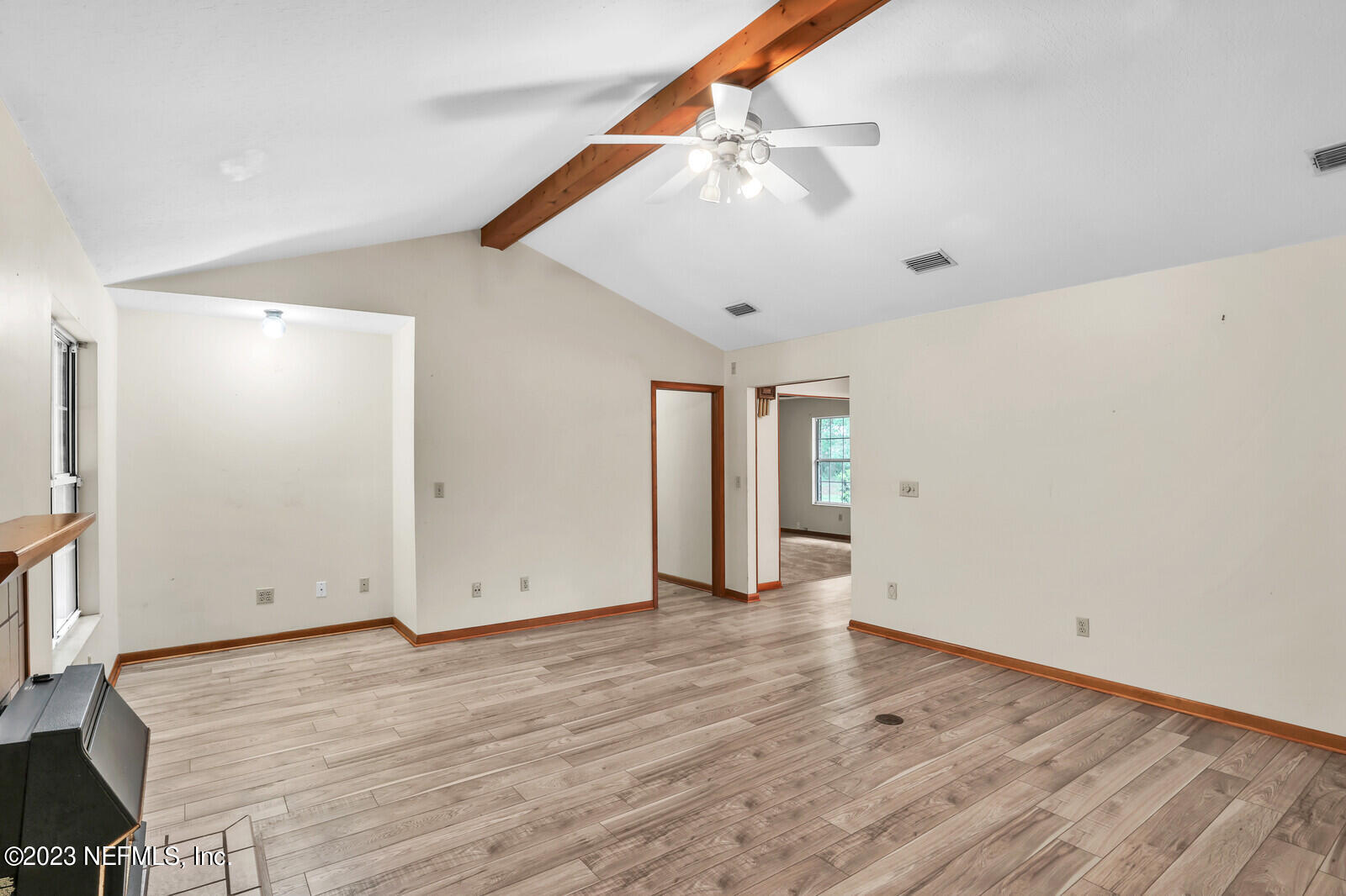 4250 Banks Road Middleburg, FL 32068 - Photo 32 of 48 an empty room with wooden floor and windows