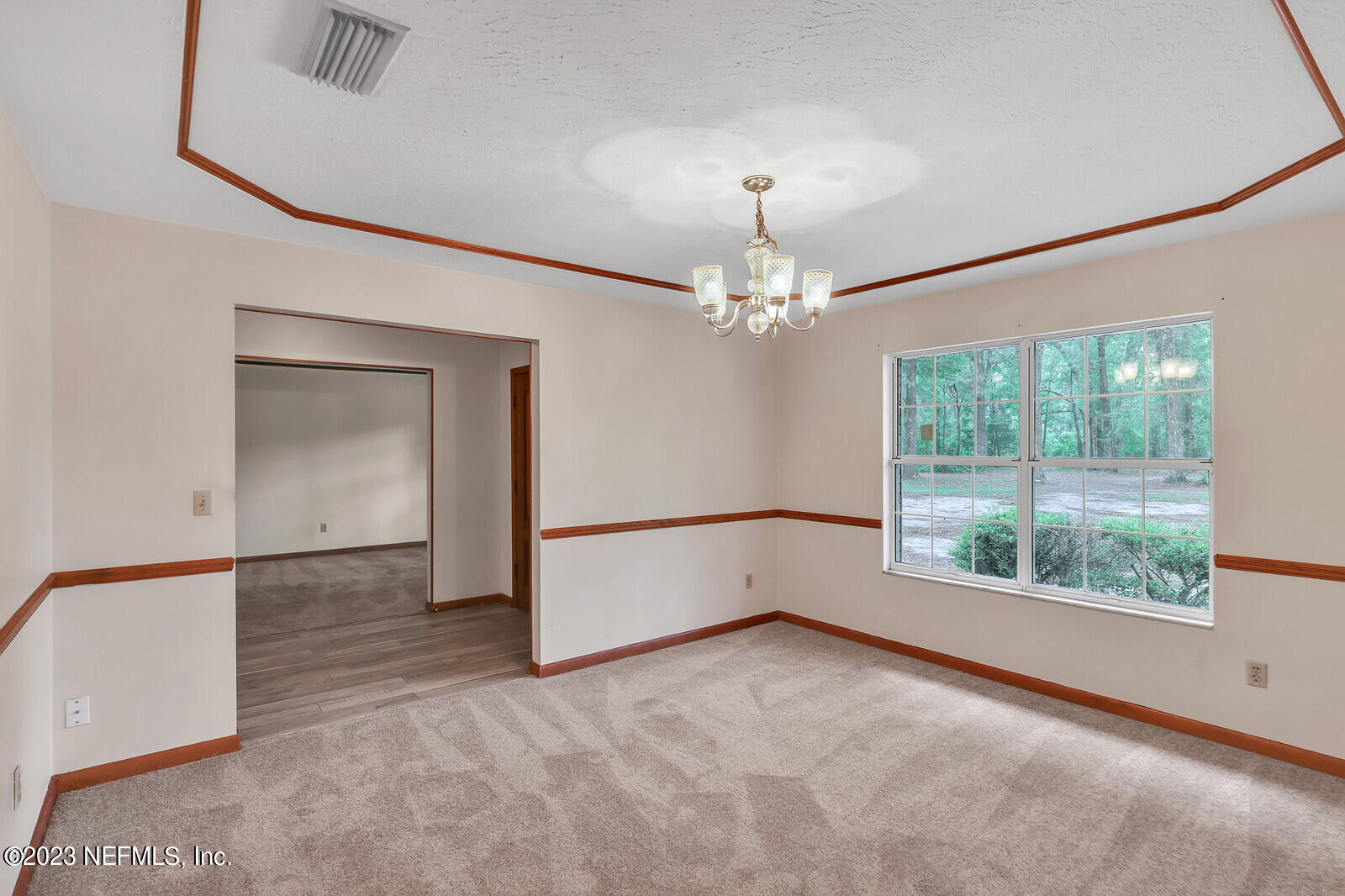 4250 Banks Road Middleburg, FL 32068 - Photo 36 of 48 en empty room with windows and outdoor view