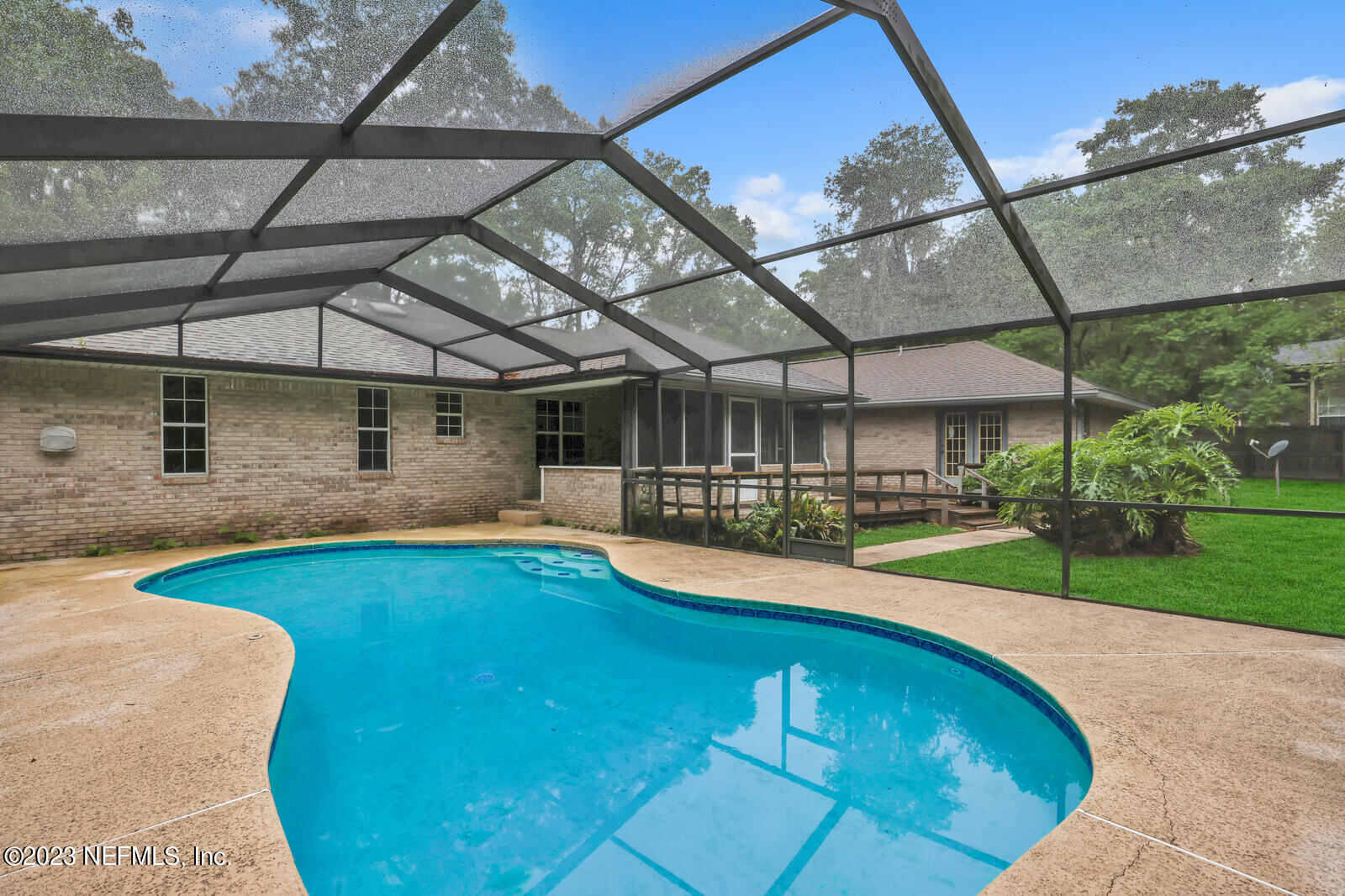 4250 Banks Road Middleburg, FL 32068 - Photo 46 of 48 a view of a swimming pool with a patio