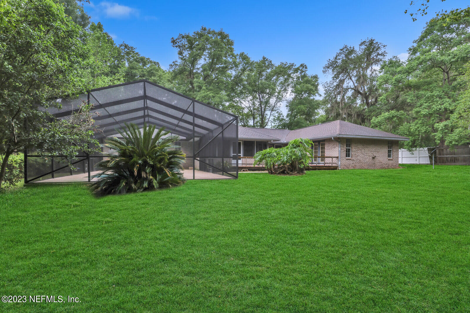 4250 Banks Road Middleburg, FL 32068 - Photo 6 of 48 a front view of a house with a garden