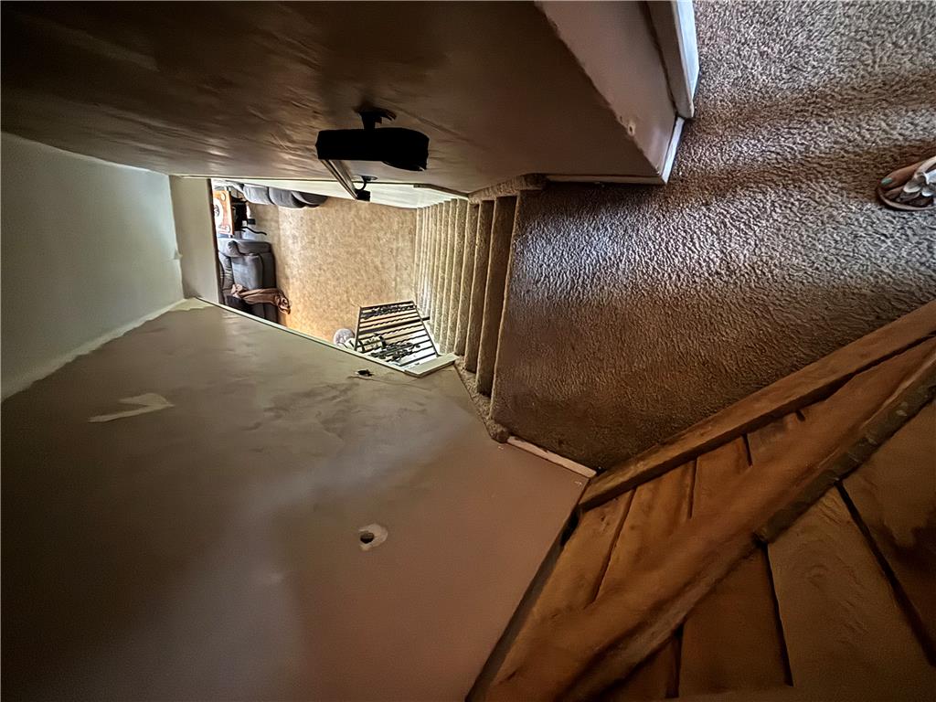 231 Laurel Road Lehighton, PA 18235 - Photo 24 of 36 Carpeted stairs descend toward the lower level living area under a vaulted ceiling line.