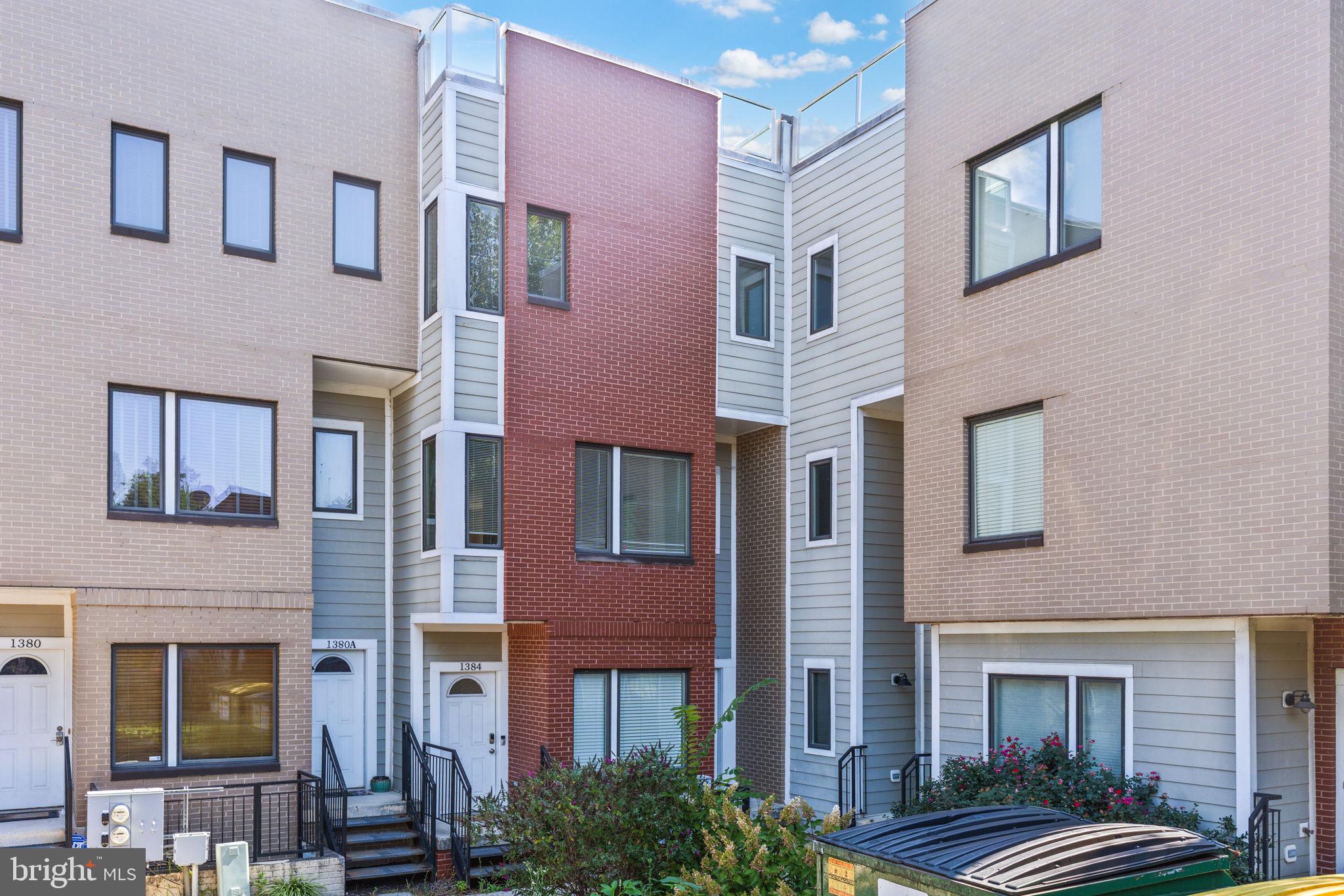 1384 Talbert Court Southeast, Unit A Washington, DC 20020 - Photo 2 of 35 a front view of a multi story residential apartment building
