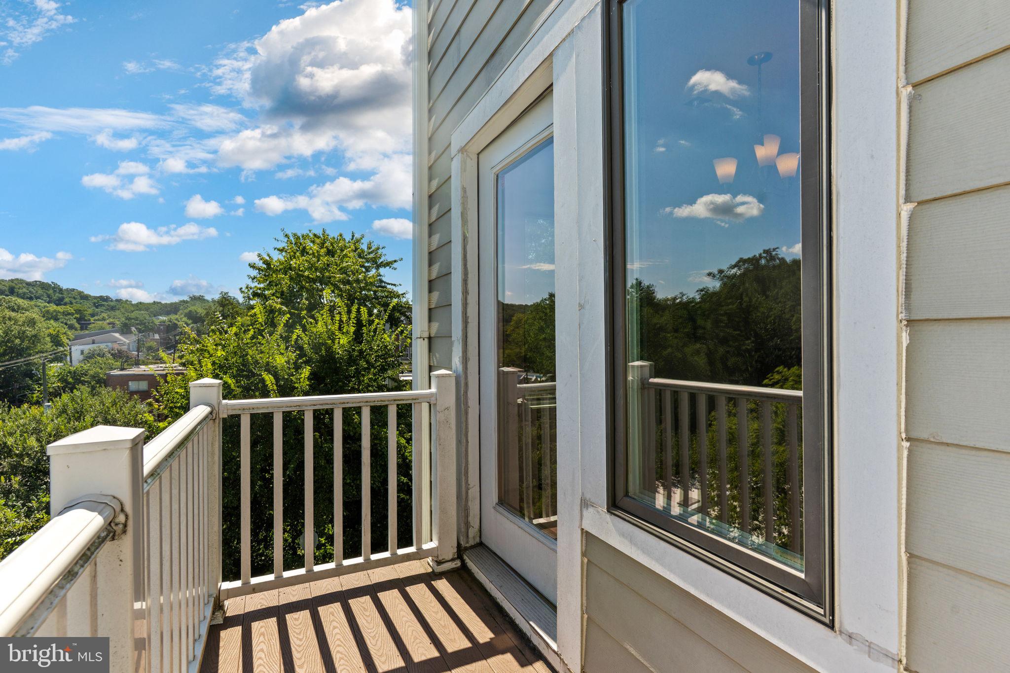 1384 Talbert Court Southeast, Unit A Washington, DC 20020 - Photo 21 of 35 a view of a balcony with wooden floor
