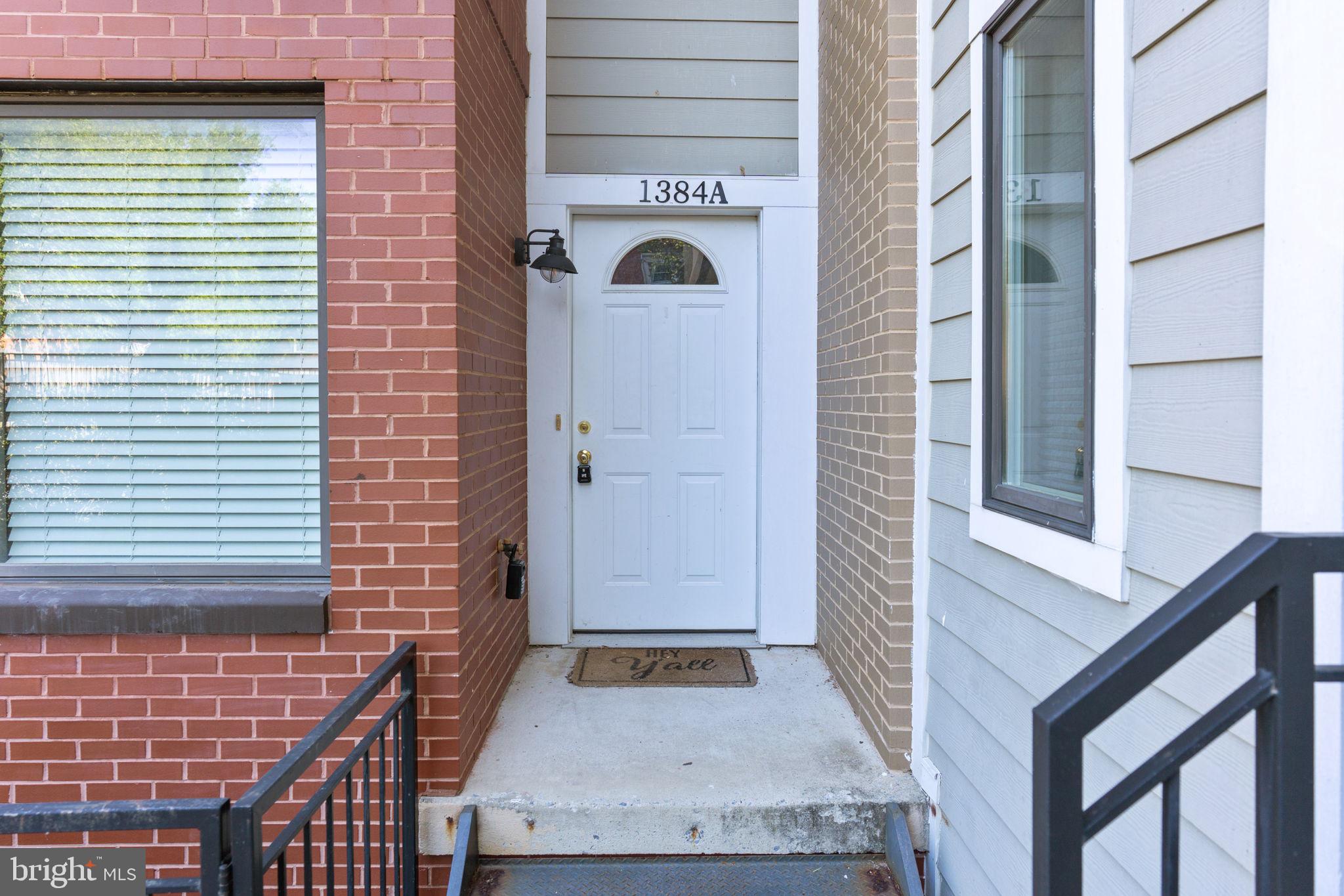 1384 Talbert Court Southeast, Unit A Washington, DC 20020 - Photo 3 of 35 a front view of a house with white walls