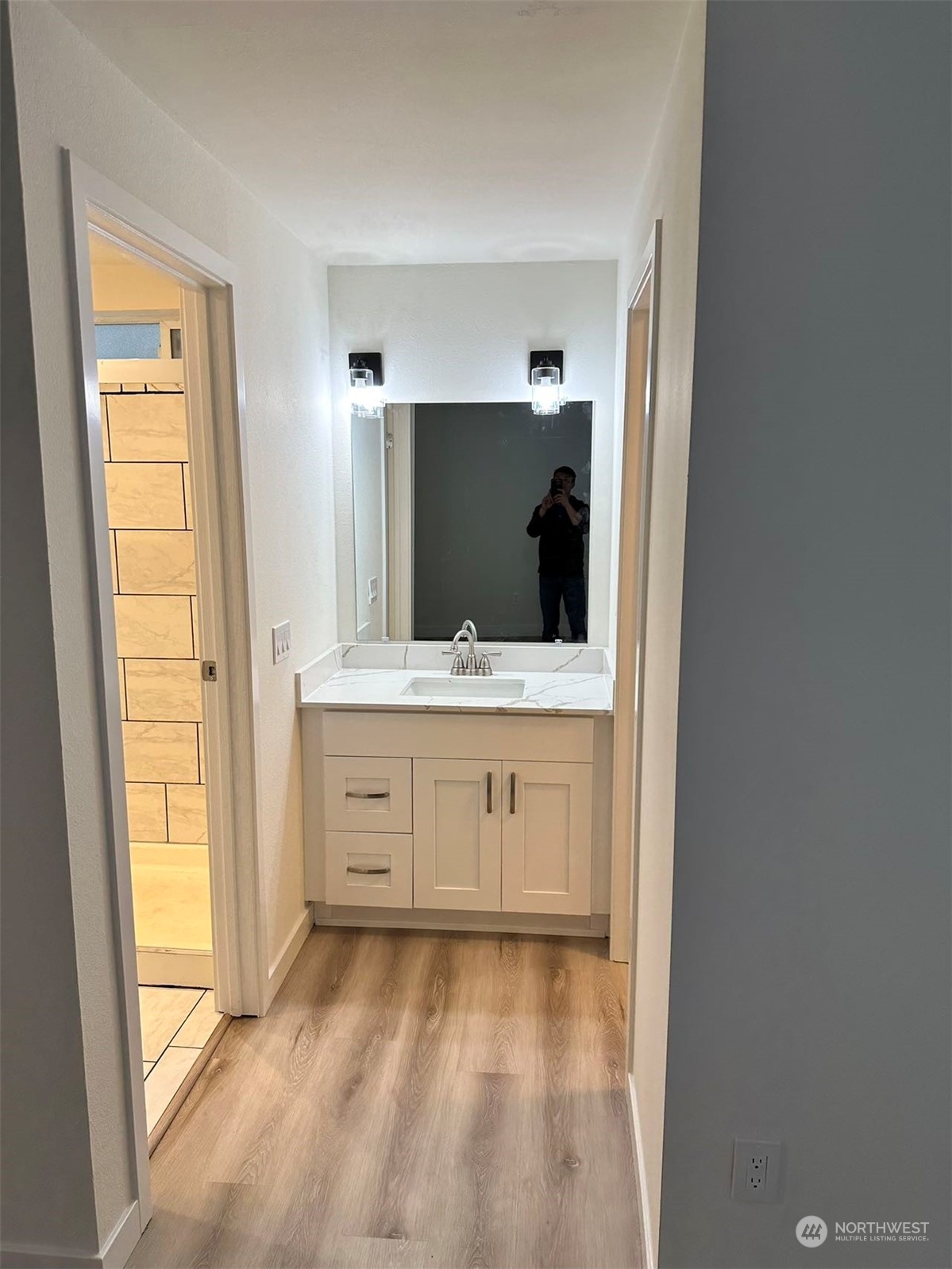 2606 Southwest 340th Place Federal Way, WA 98023 - Photo 12 of 28 a bathroom with a sink and a mirror