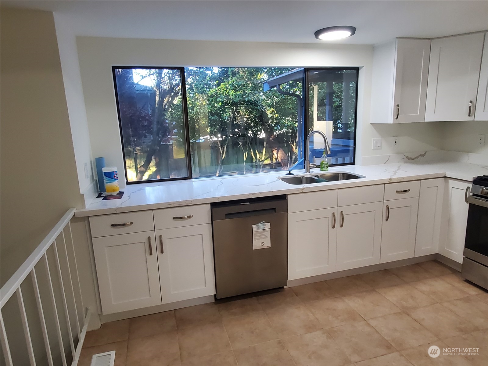2606 Southwest 340th Place Federal Way, WA 98023 - Photo 7 of 28 a kitchen with white cabinets and window
