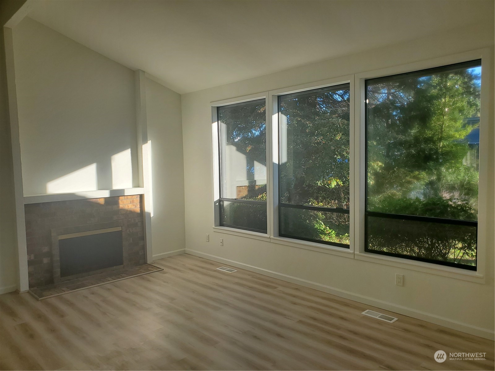 2606 Southwest 340th Place Federal Way, WA 98023 - Photo 8 of 28 a view of a glass door with wooden floor and garden