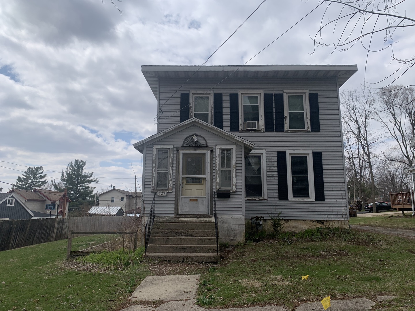 104 Grant Street Harvard, IL 60033 - Photo 14 of 14 a front view of a house with a yard