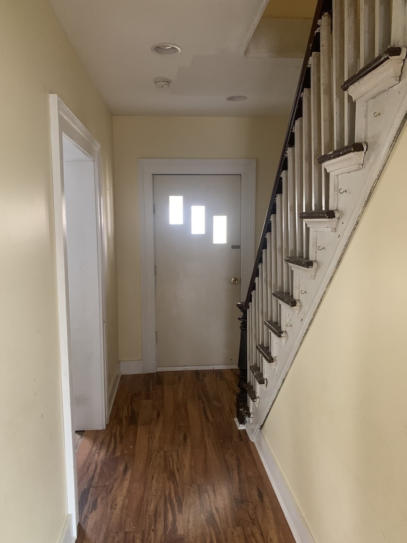 104 Grant Street Harvard, IL 60033 - Photo 3 of 14 a view of entryway with wooden floor