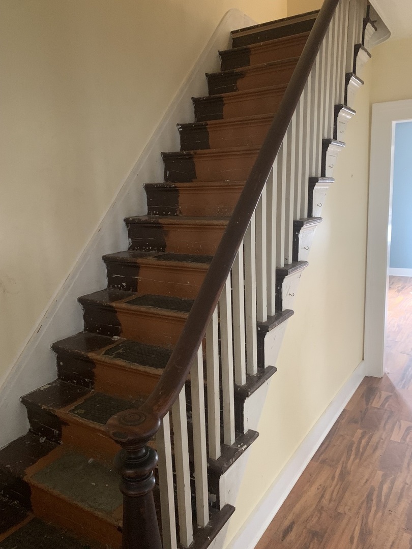 104 Grant Street Harvard, IL 60033 - Photo 4 of 14 a view of entryway with wooden floor