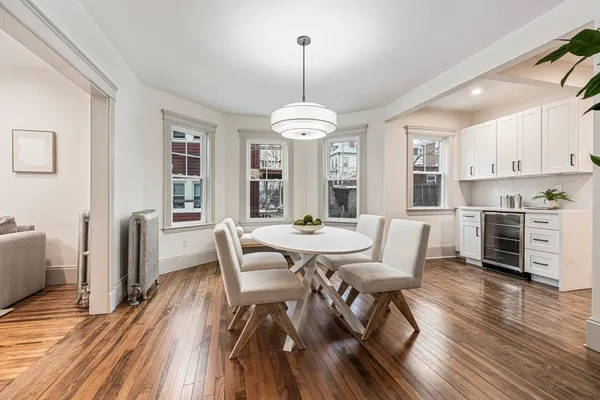 a dining room with furniture window wooden floor