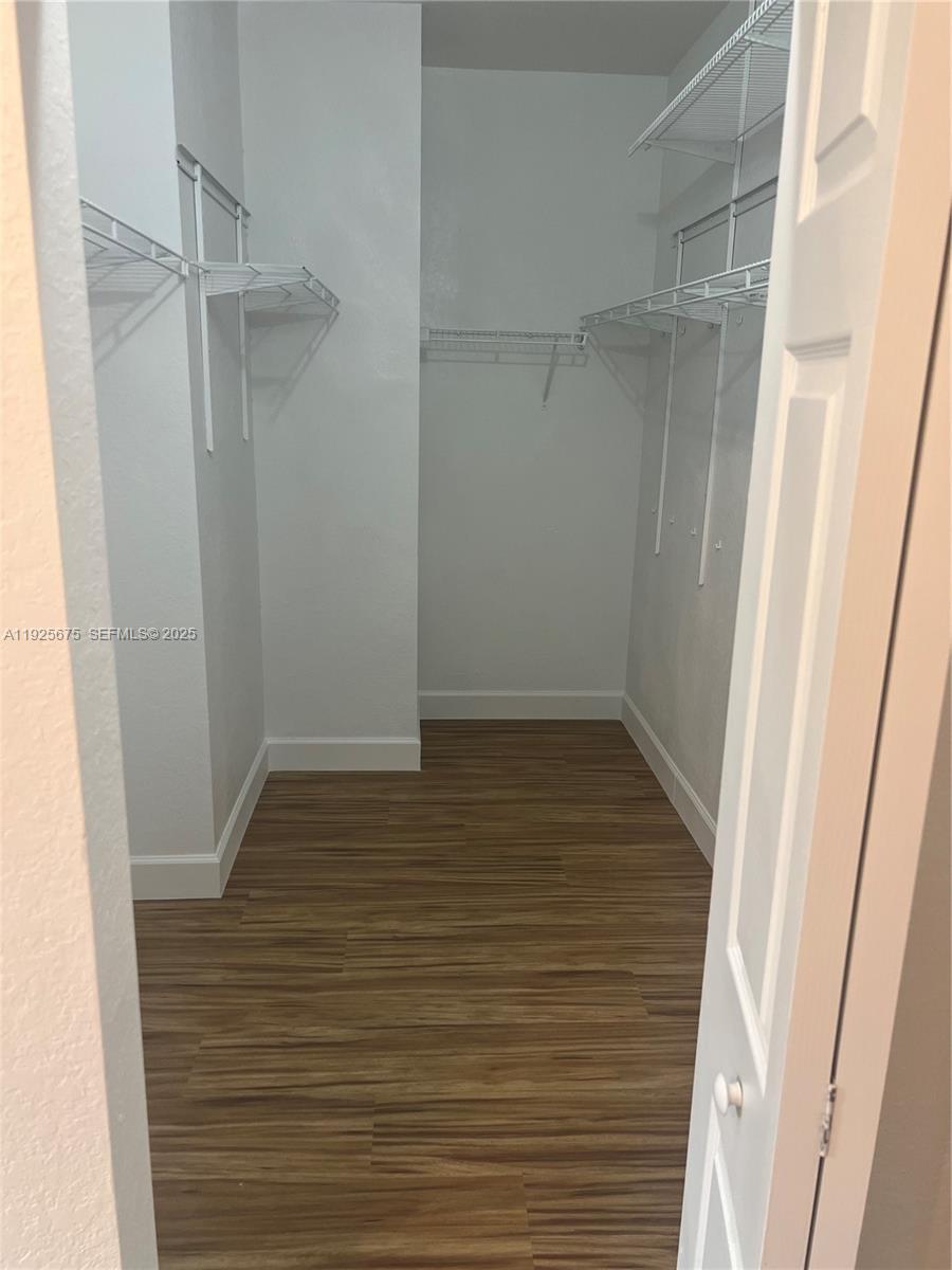 11467 Southwest 238th Street Homestead, FL 33032 - Photo 13 of 16 a view of an empty walk in closet