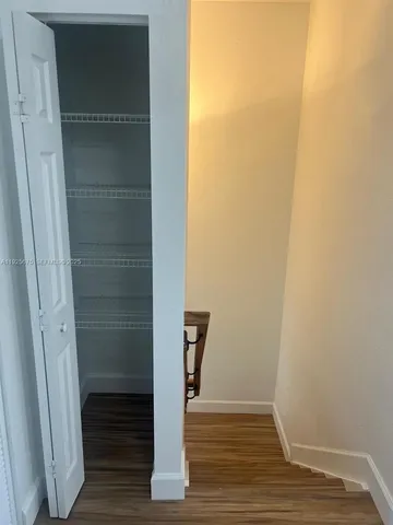 a view of front door with wooden floor