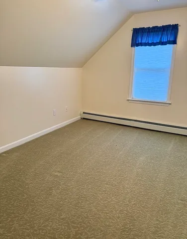a bathroom with a granite countertop toilet sink and mirror