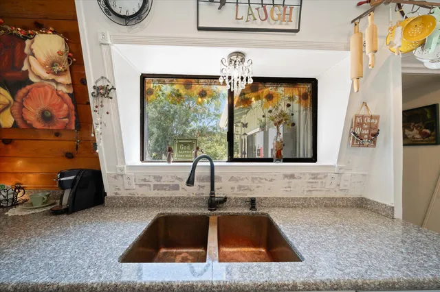 a bedroom with a bed and a table