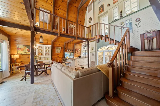 a dining room with furniture and wooden floor